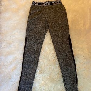 Athletic leggings, barely worn, with a fishnet material done the sides.